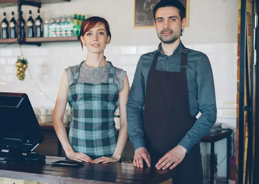 Two small business owners behind their shop counter