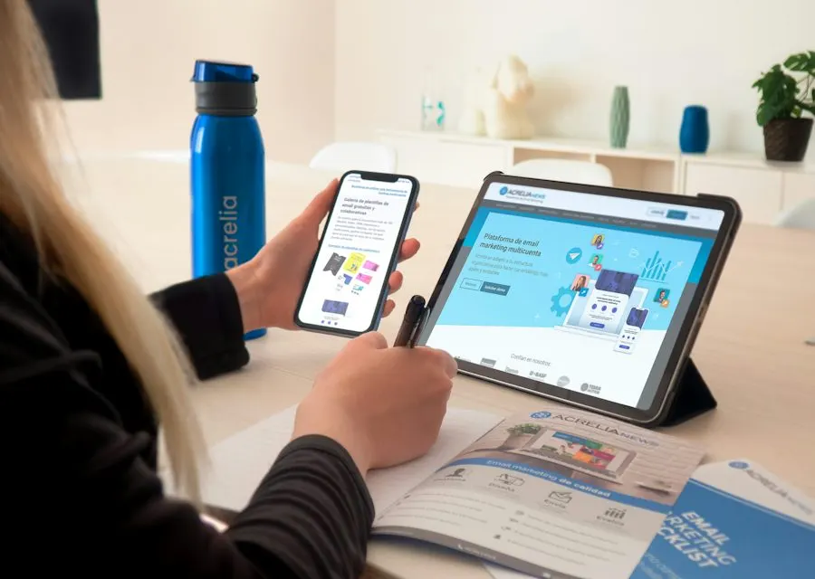 Person checking email on a phone and tablet